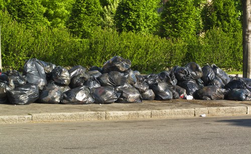 Street scene showing sustainable rubbish area with recycling containers